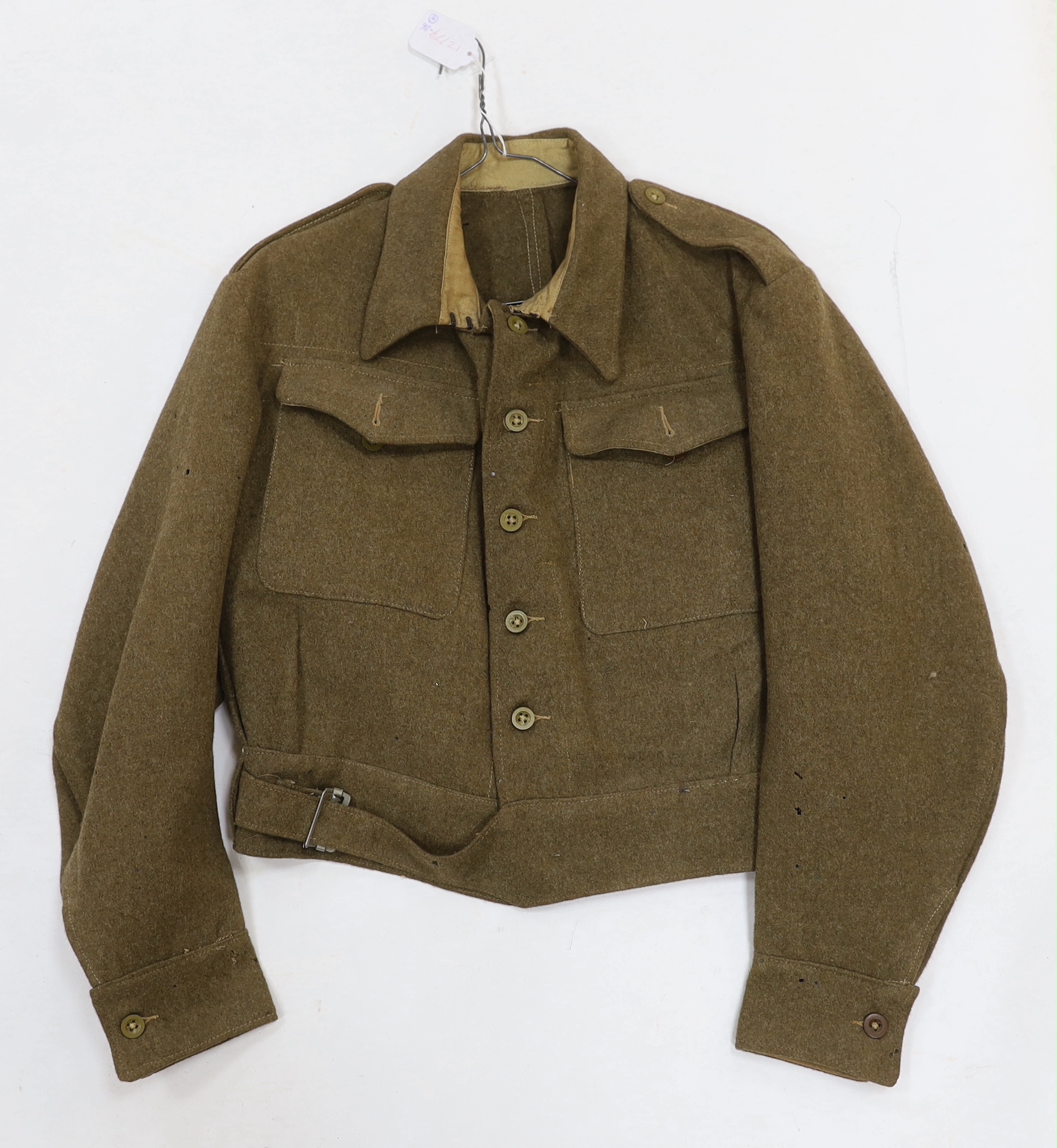 Eight British military uniform blouses/jackets, including two with Royal Sussex Regiment Cinque Ports shoulder insignia, a Queen’s A.C.F. example, etc.